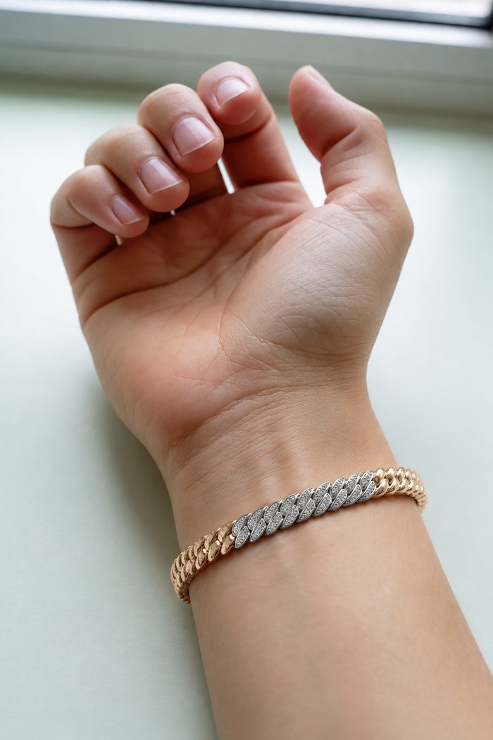 The same wrist with the two-tone chain bracelet, rendered from the buyer's own photo