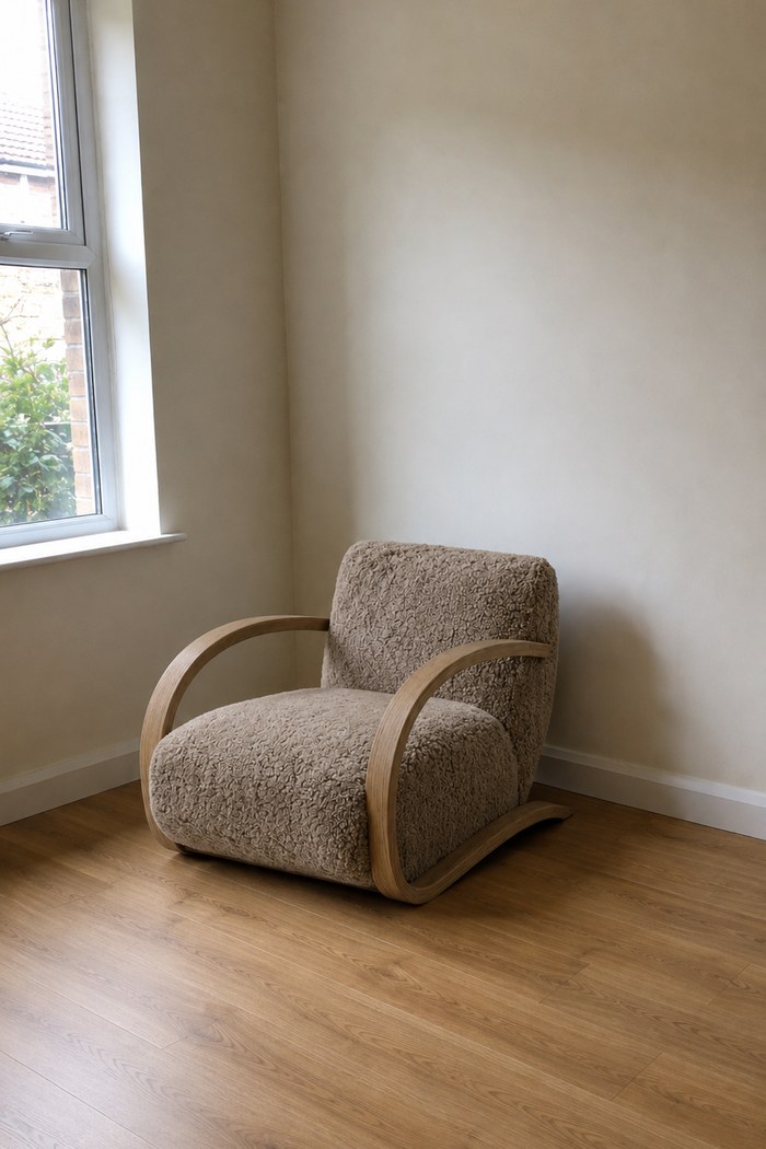 The lounge chair standing in the buyer's own empty room, rendered from their photograph