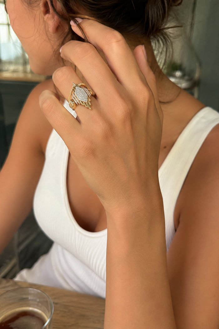 A rose-gold pavé ring styled into a café lifestyle scene